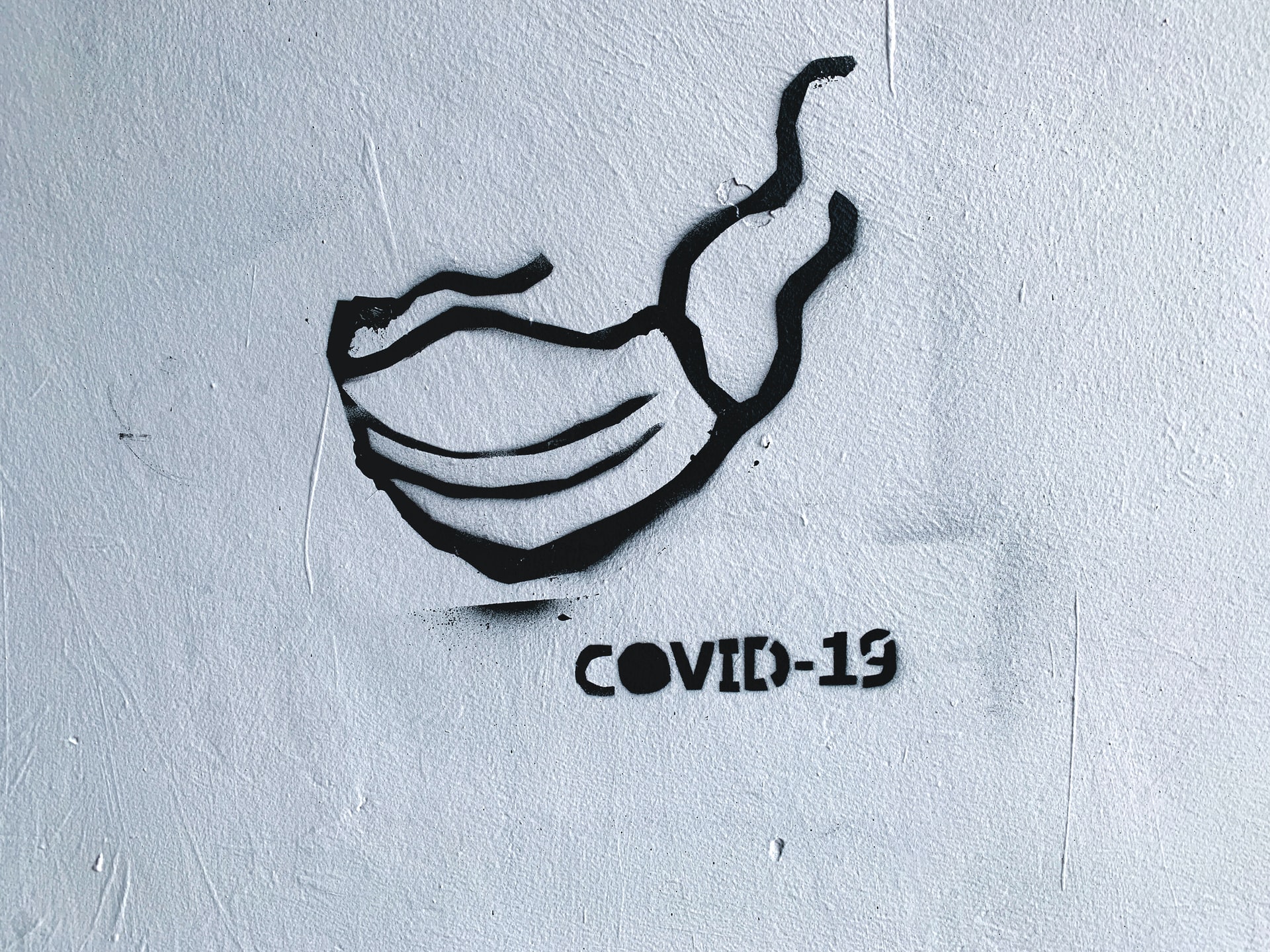 Graffiti, jossa teksti Covid-19.